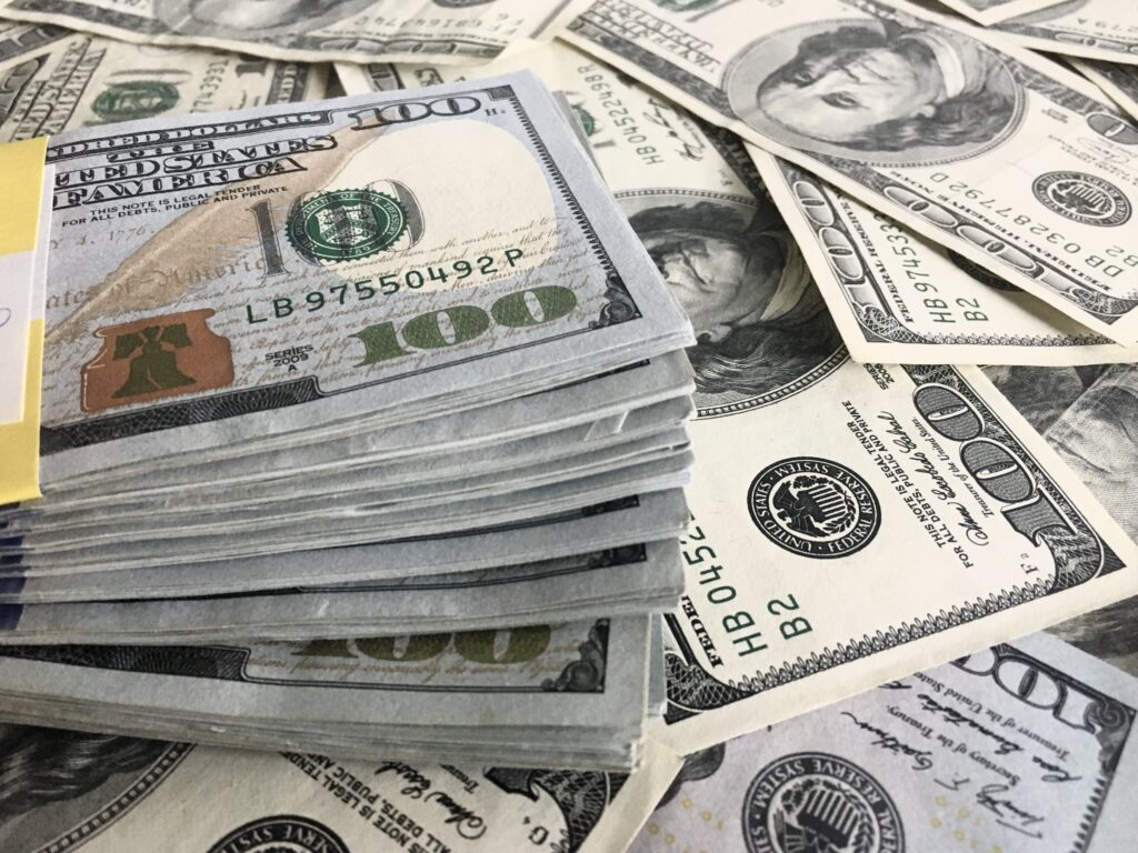 Stacks of dollars piled on top of each other.
